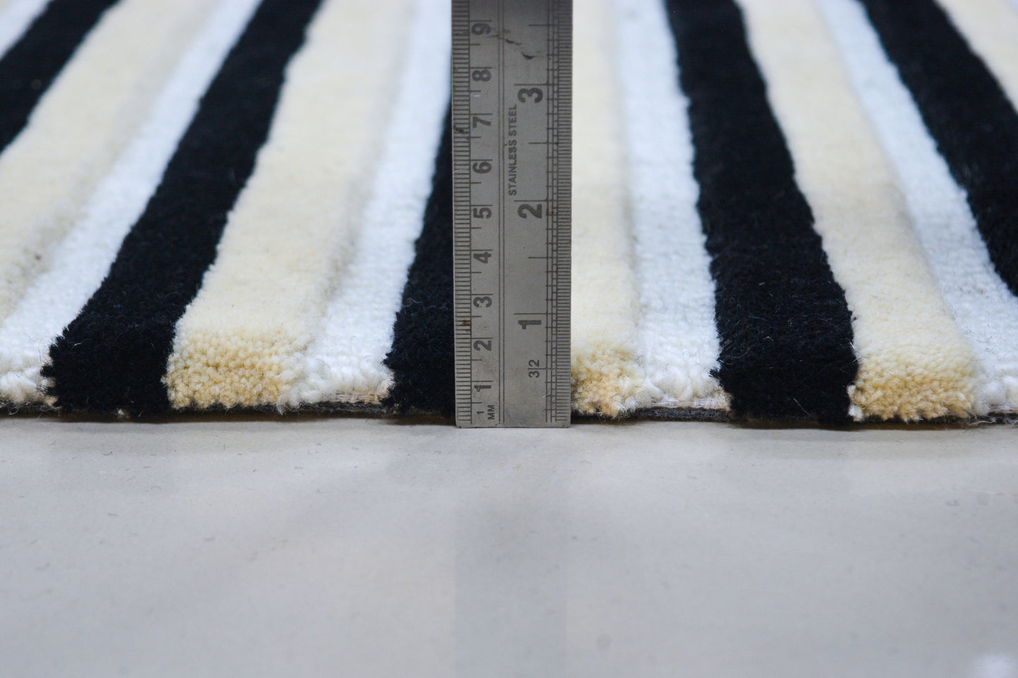 showing pile height of Alpine hand tufted wool rug