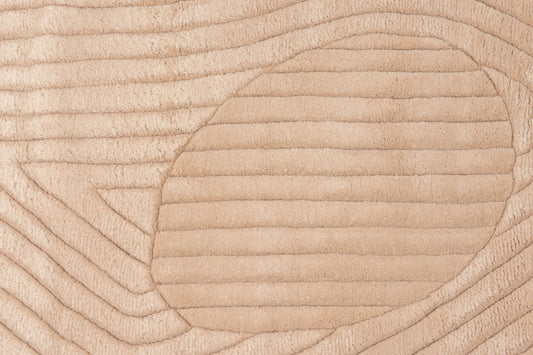 close view of Round NZ wool rug in beige