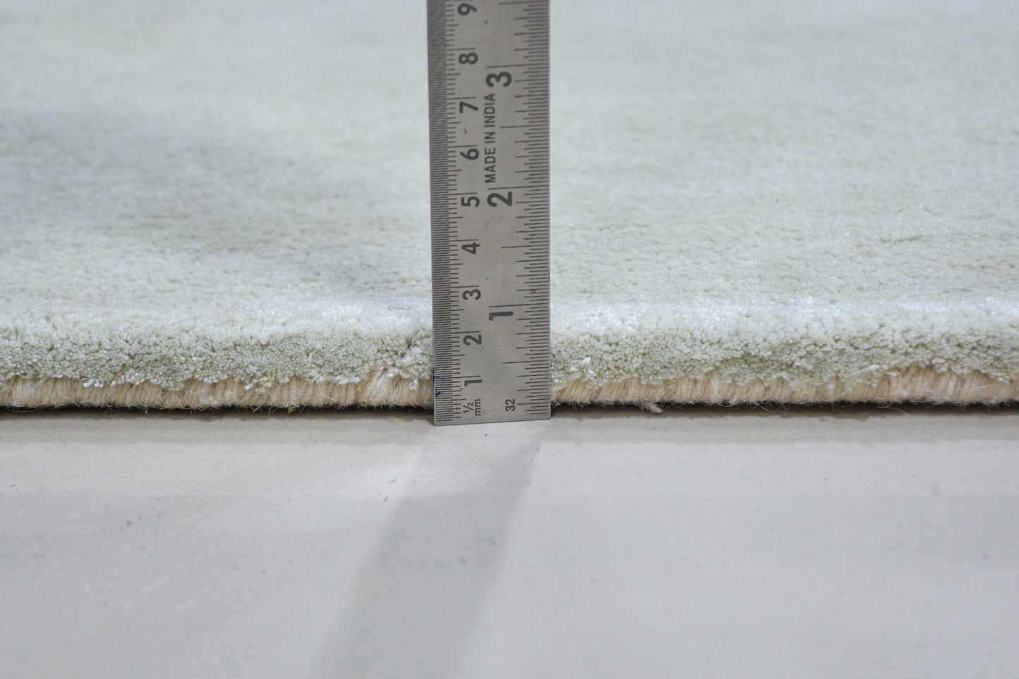 showing pile height of IMARA hand tufted wool & silk rug