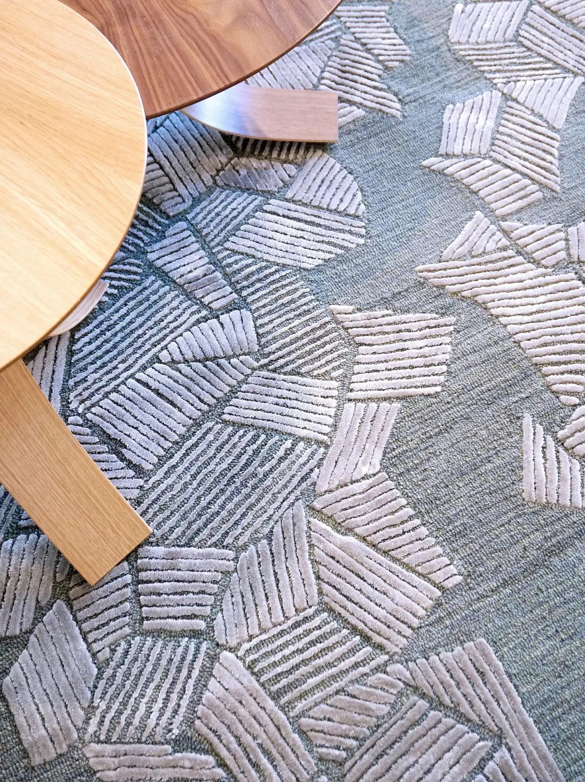 Close-up of a hand tufted textured gray patterned carpet made of wool and silk