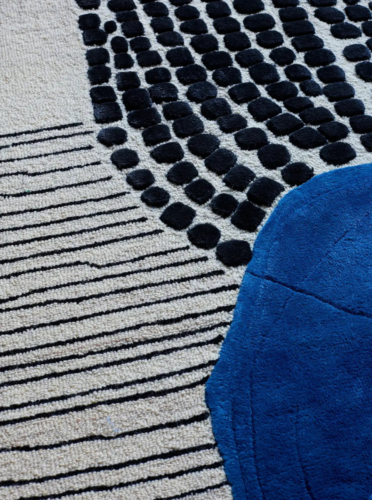 hand tufted blue wool and silk rug close view