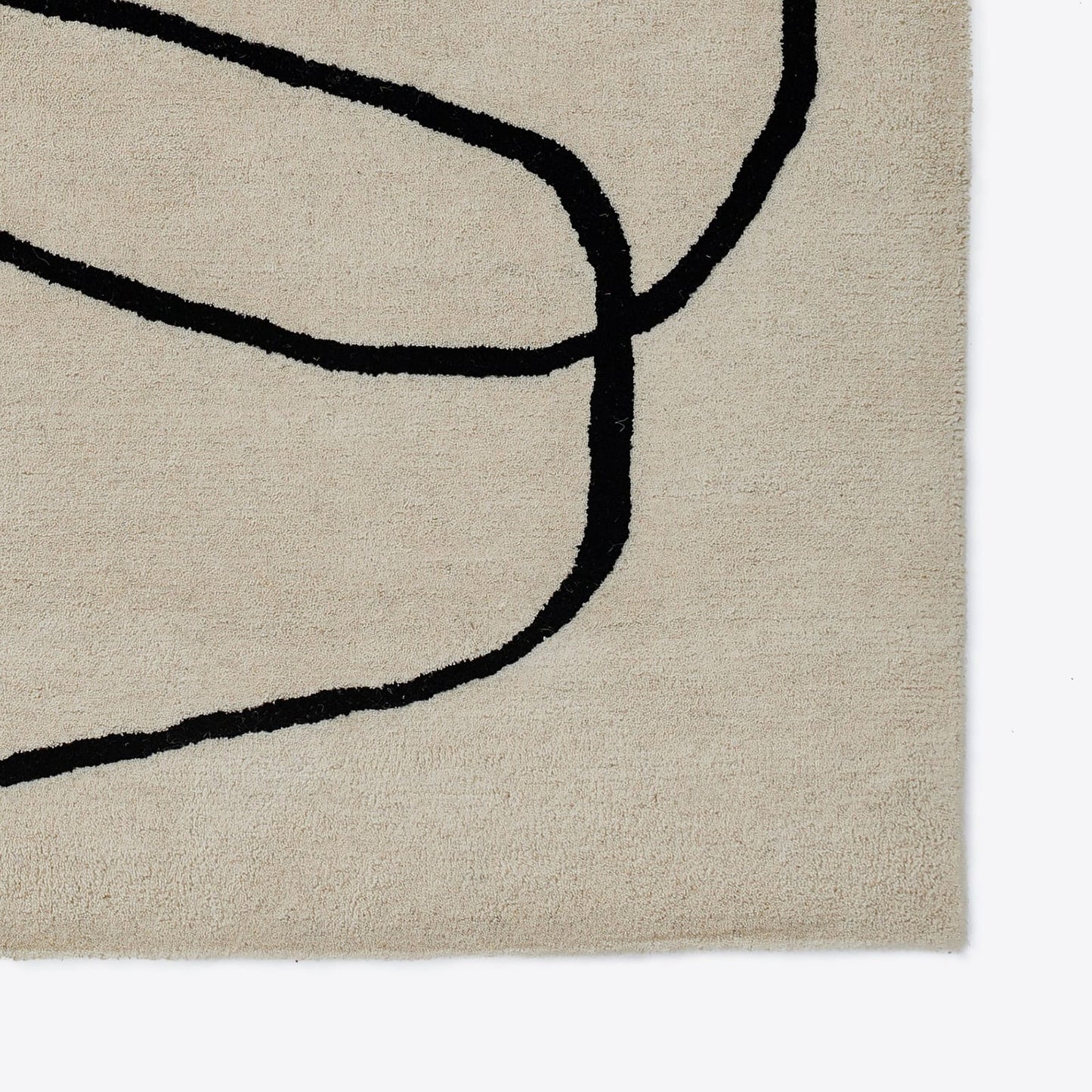 close corner view of Limree beige wool rug