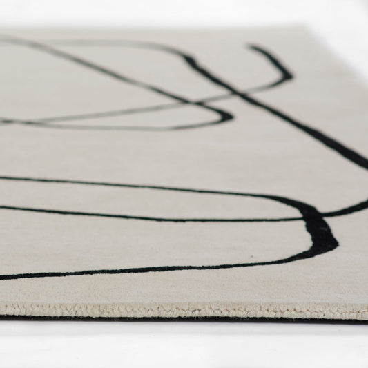 close side view of Limree beige wool rug