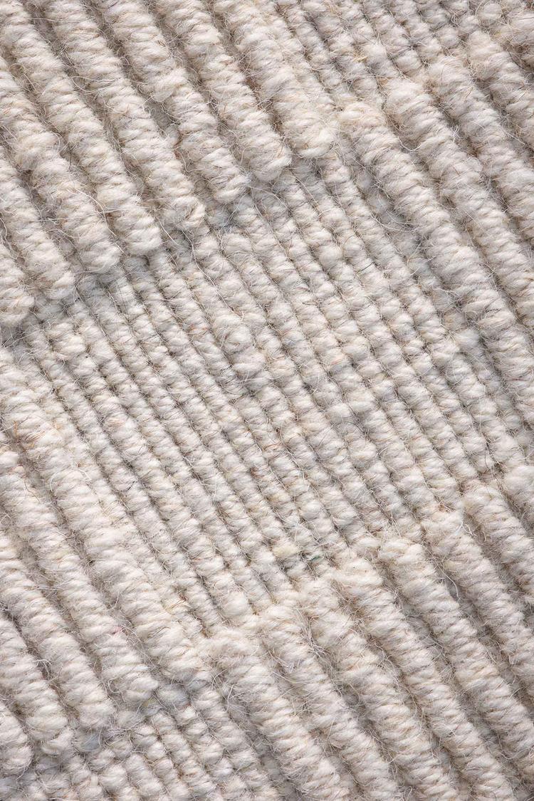 close view of Sea off white handloom rug showing knot details