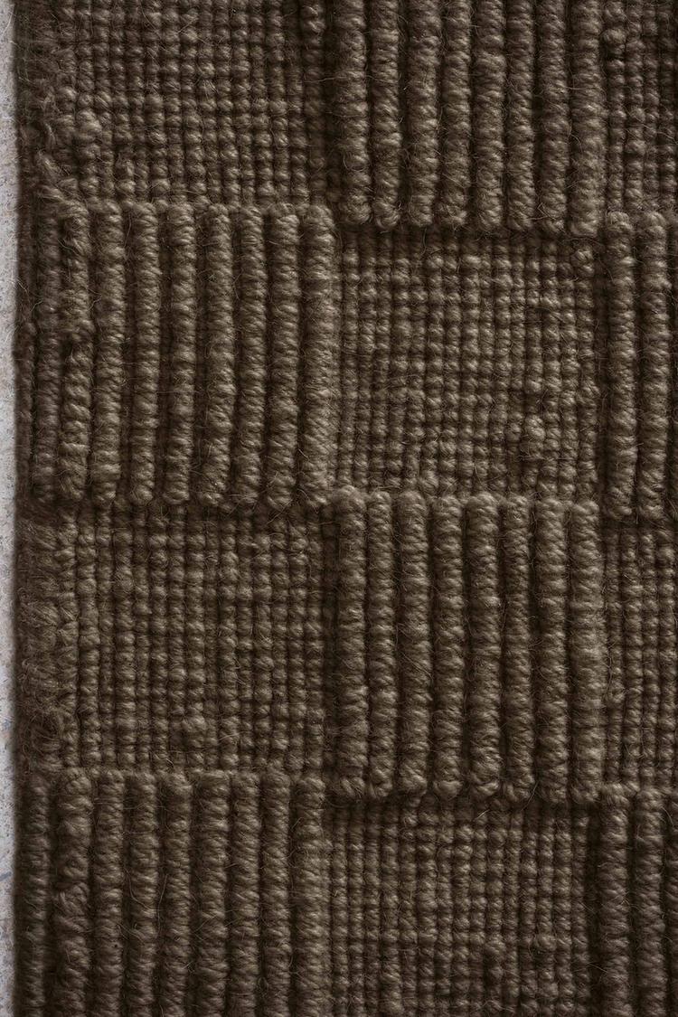 Seval brown handloom textured rug, showing square pattern design