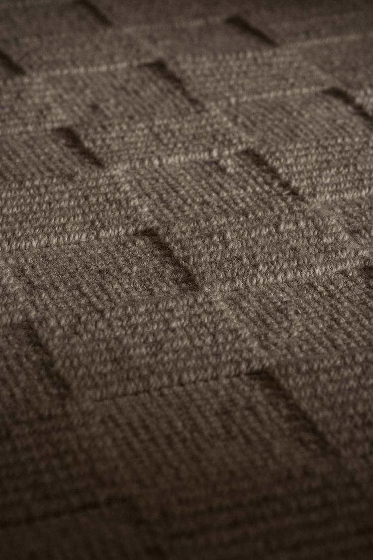 close view of Seval brown handloom textured area rug