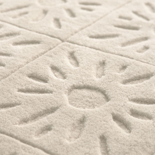 close view of Zaraa premium white wool rug, showing pattern design