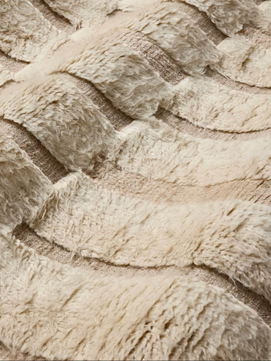 beige hand knotted wool area rug