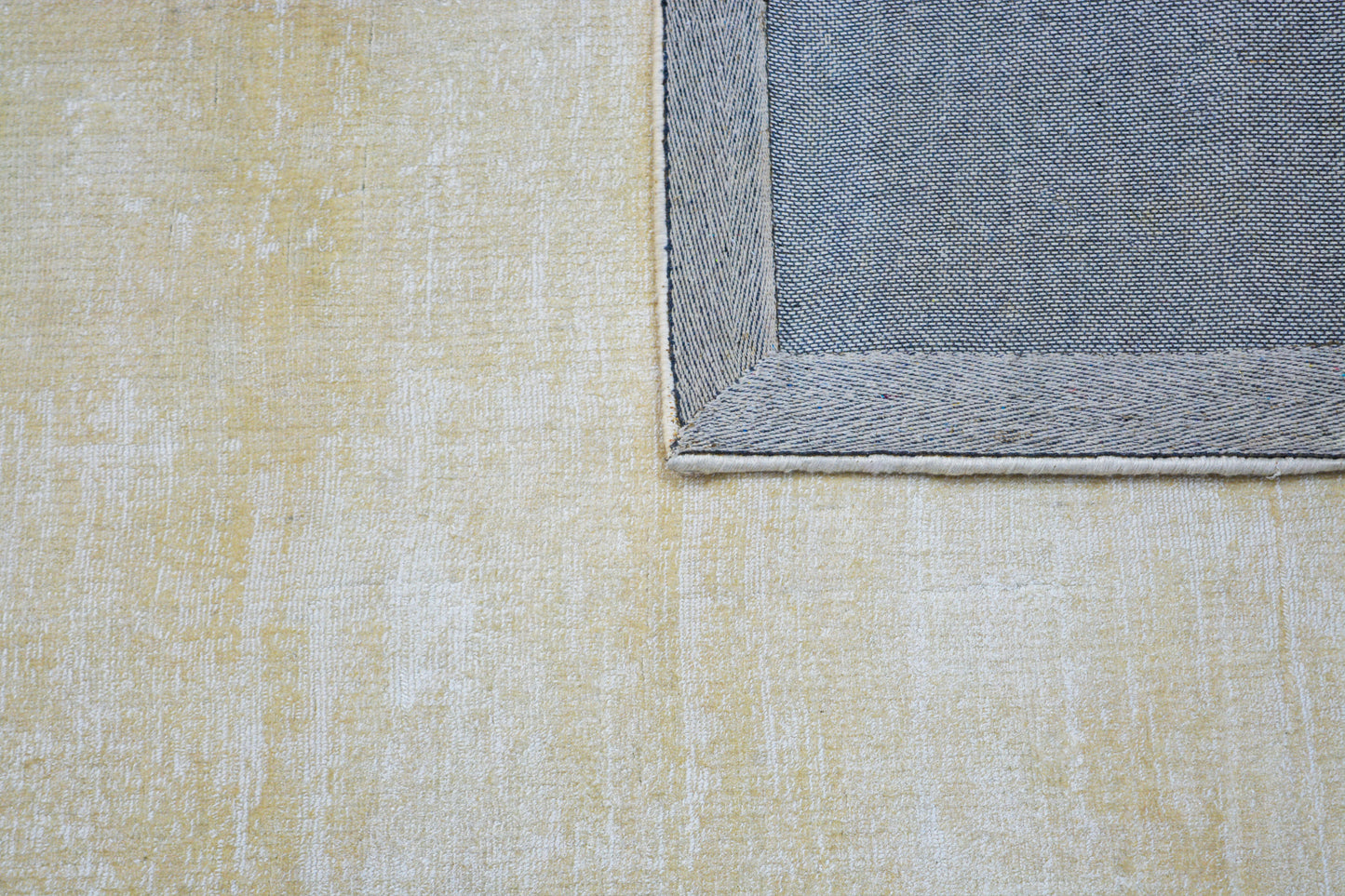 bhadohi beige wool & silk area rug, showing back side of rug