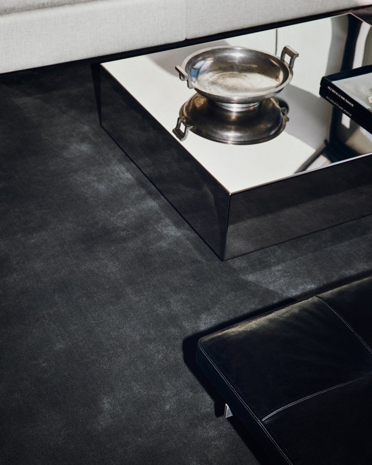rich black hand-tufted wool rug in living area