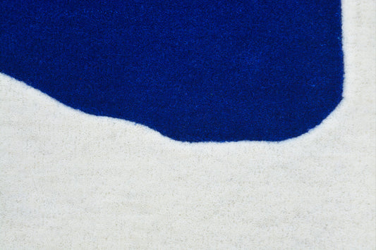 close view of blue hand tufted wool rug