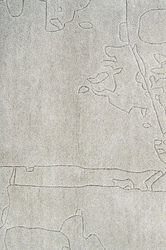 close view of hand tufted abstract textured gray wool rug with a subtle pattern