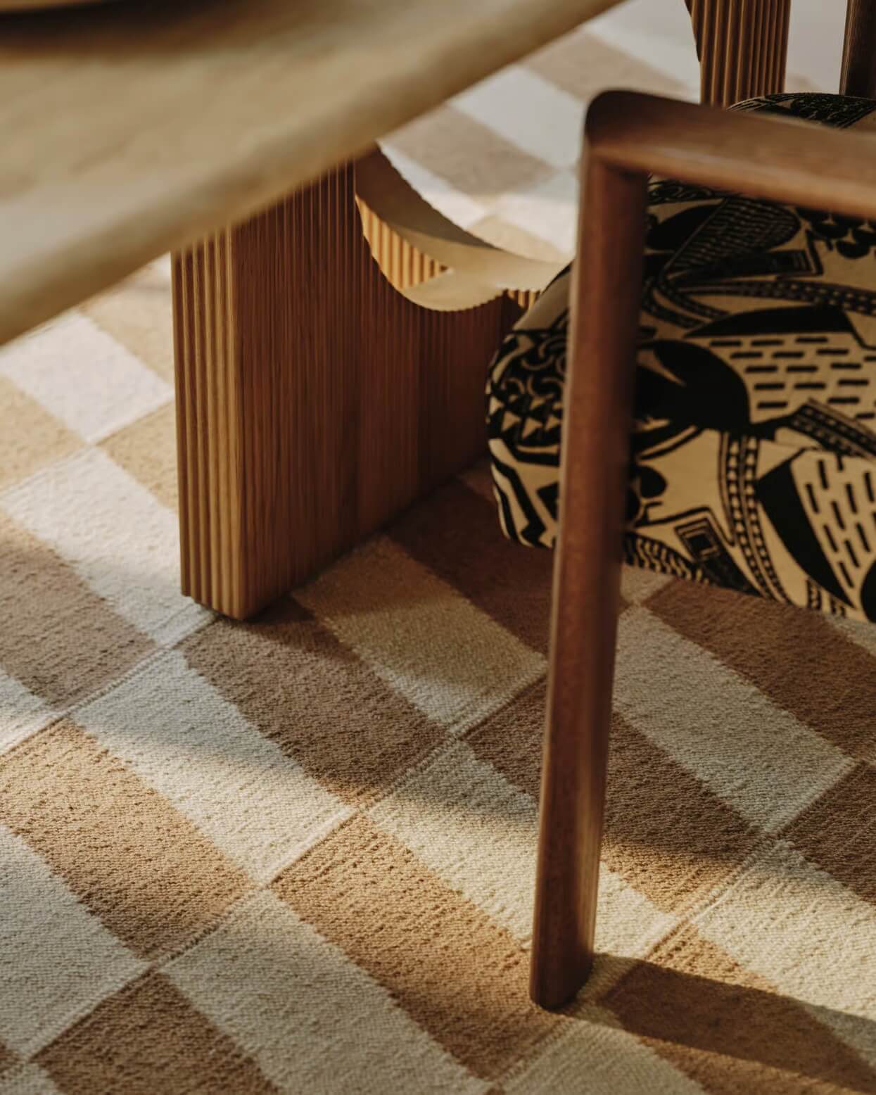Wooden chair and table on a patterned hand woven carpet