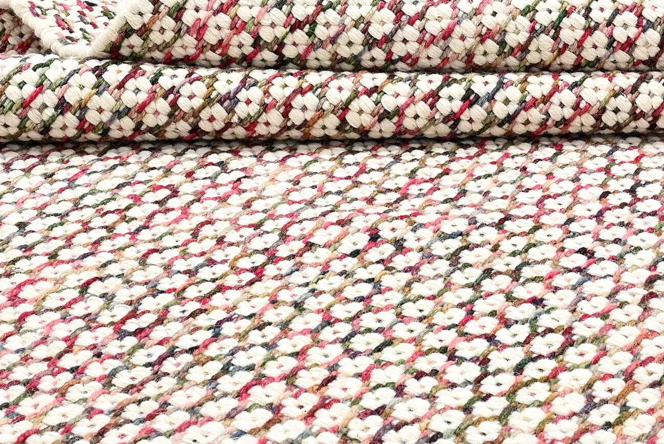 close-up of a hand woven patterned wool area rug