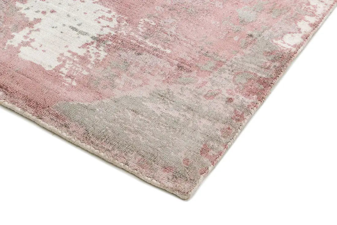close-up of hand woven blush pink viscose abstract rug
