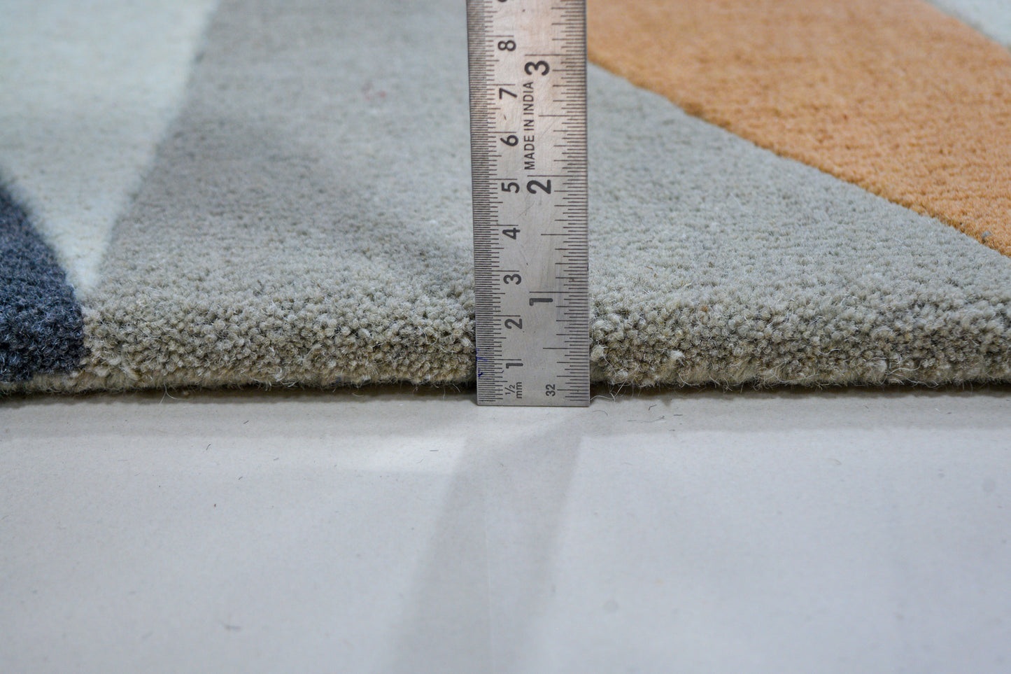 showing pile height of modern hand-tufted wool rug
