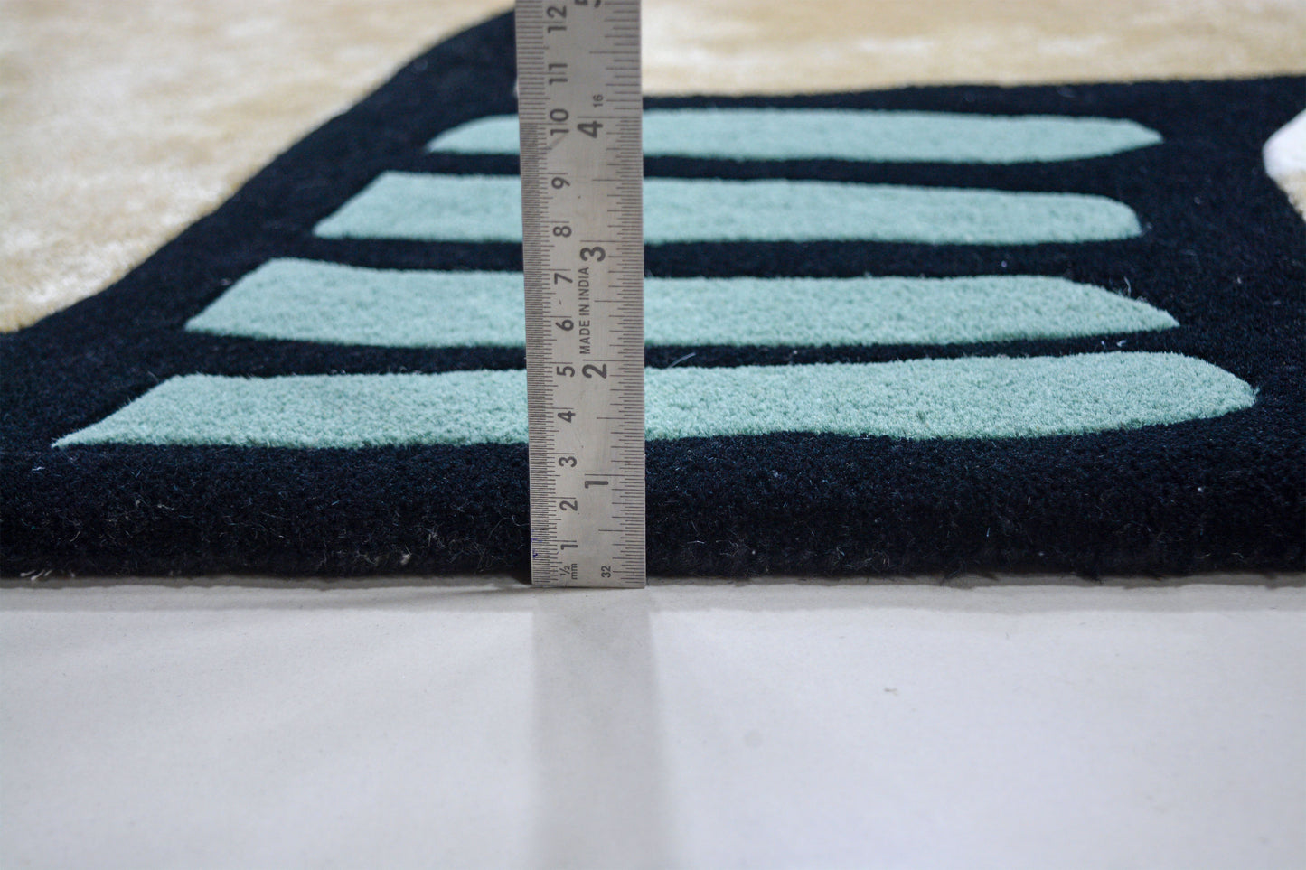 showing pile height of bhadohi hand-tufted wool shaped rug