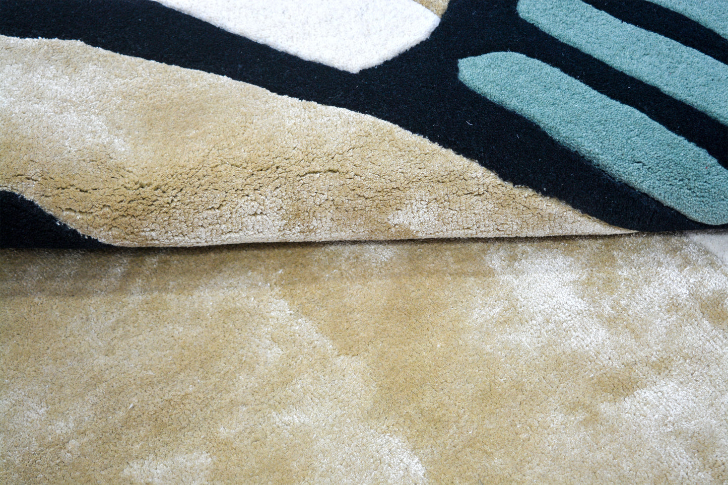 hand-tufted wool shaped rug, close view