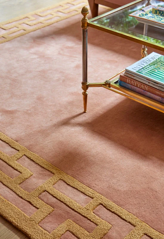 living area with hemma wool rug with sleek border design