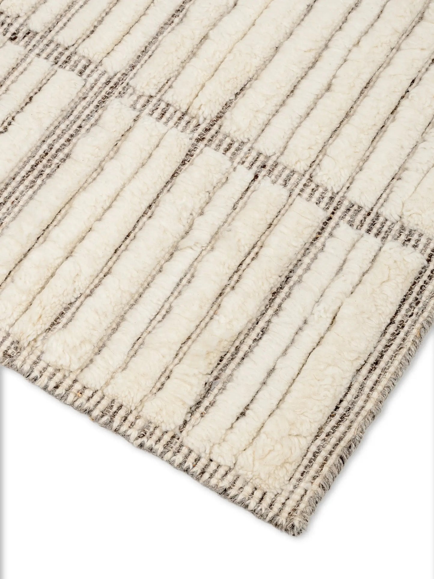 Close-up of a textured off white wool rug