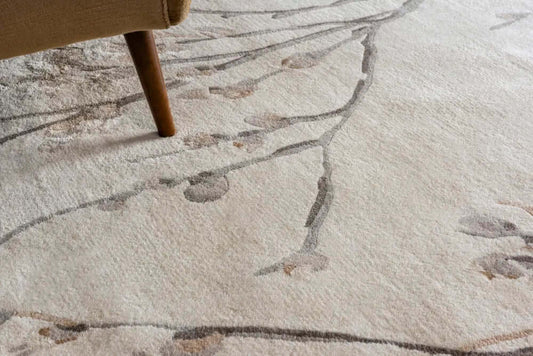 close up of a floral hand tufted wool rug