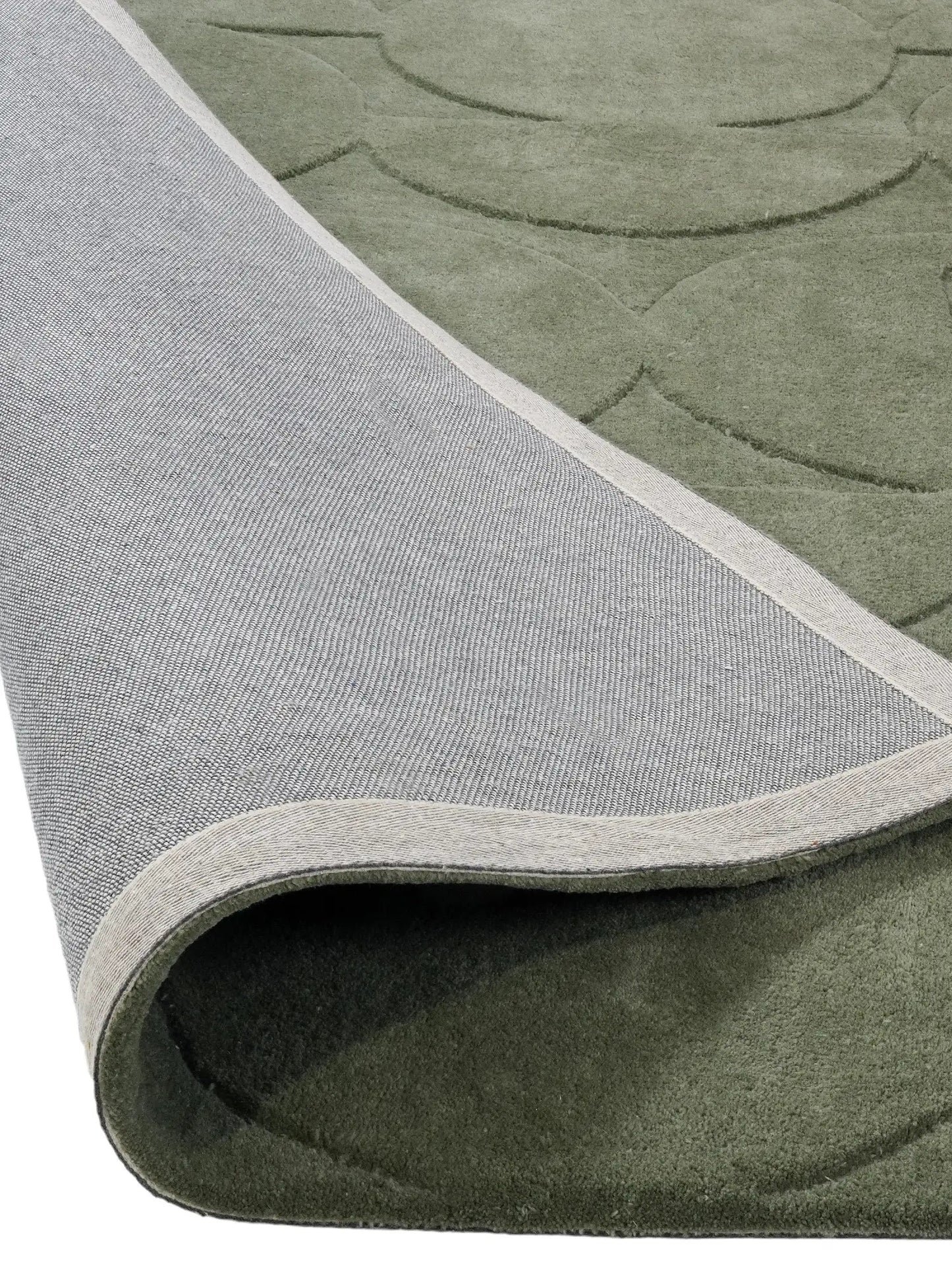 green hand tufted wool rug