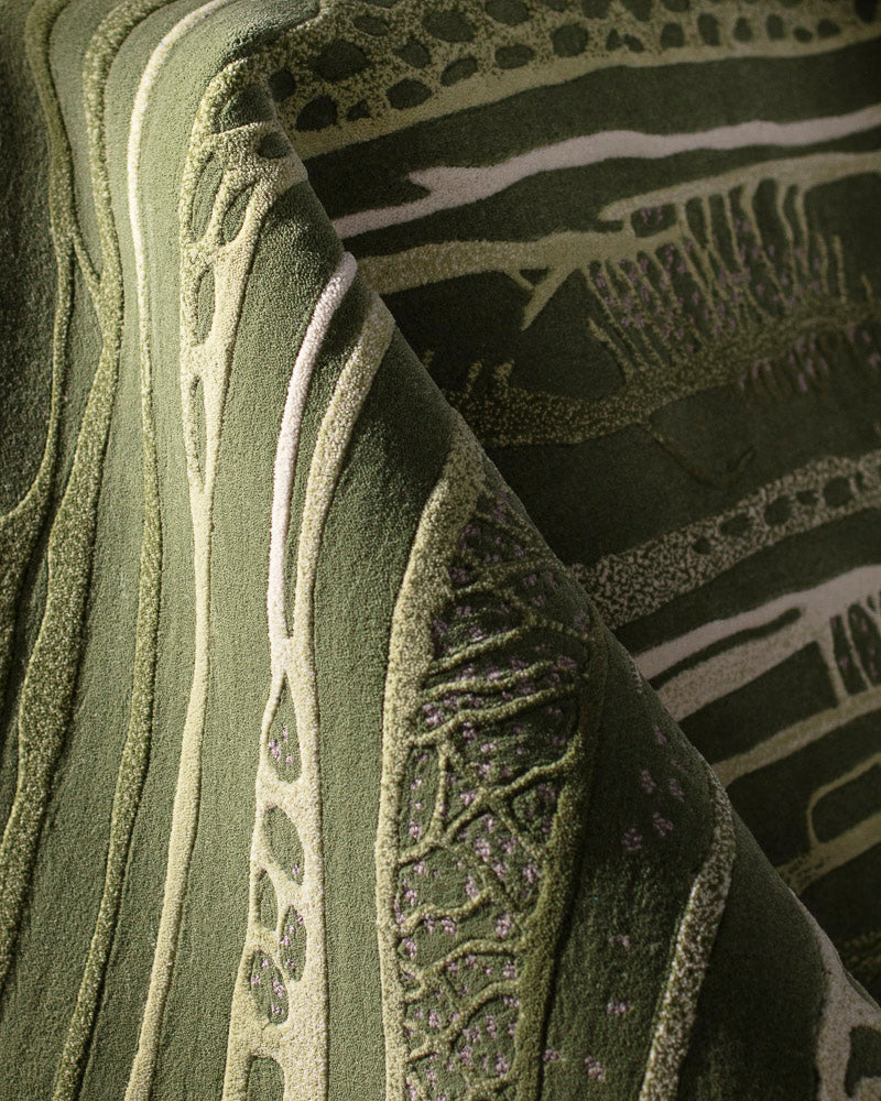 close view of green wool & silk rug showing the texture detail