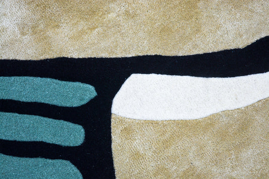 close view of hand-tufted wool shaped rug