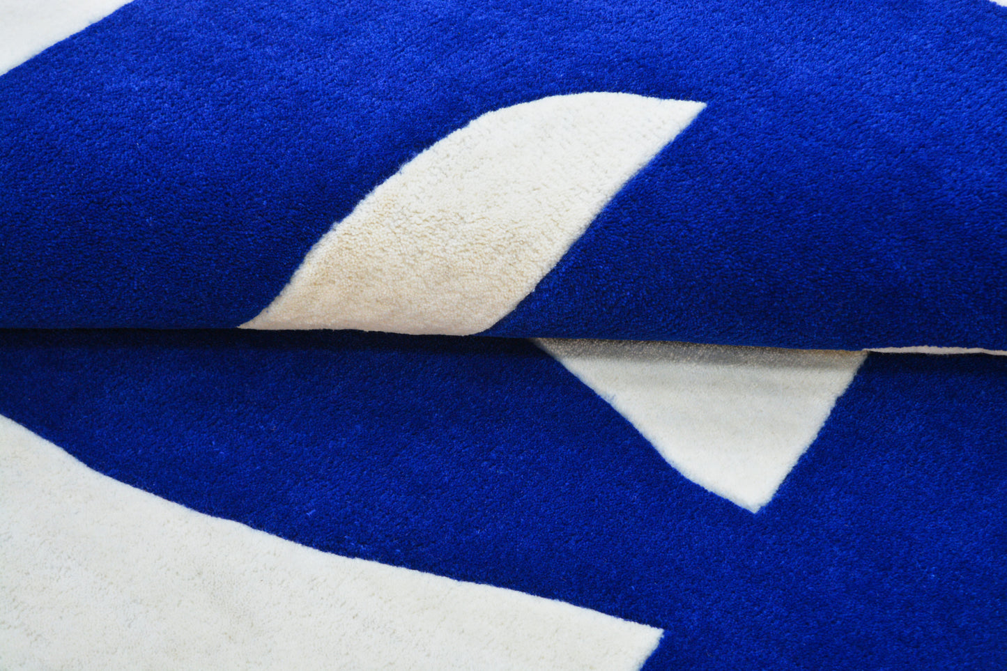 close view of lattice mdern blue hand tufted wool rug