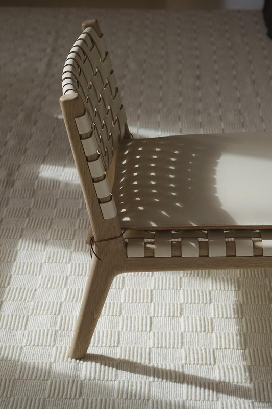 chair on sea off white handloom rug