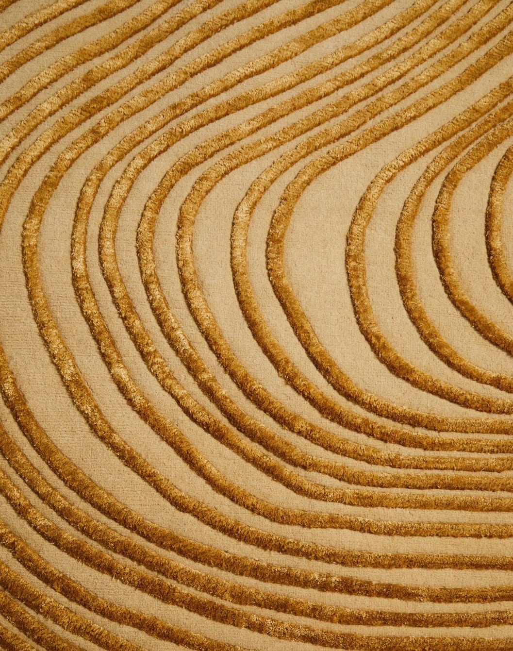 close view of premium hand tufted wool & silk rug, showing wave design