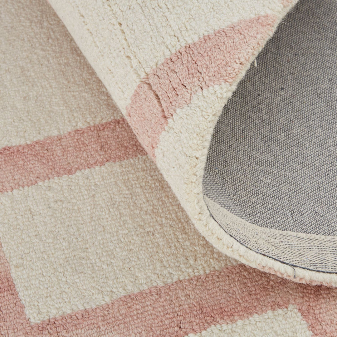 close up view of romee hand tufted wool carpet, showing the texture