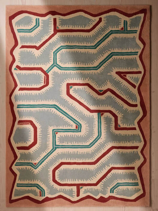 hand tufted wool rug with abstract geometric pattern