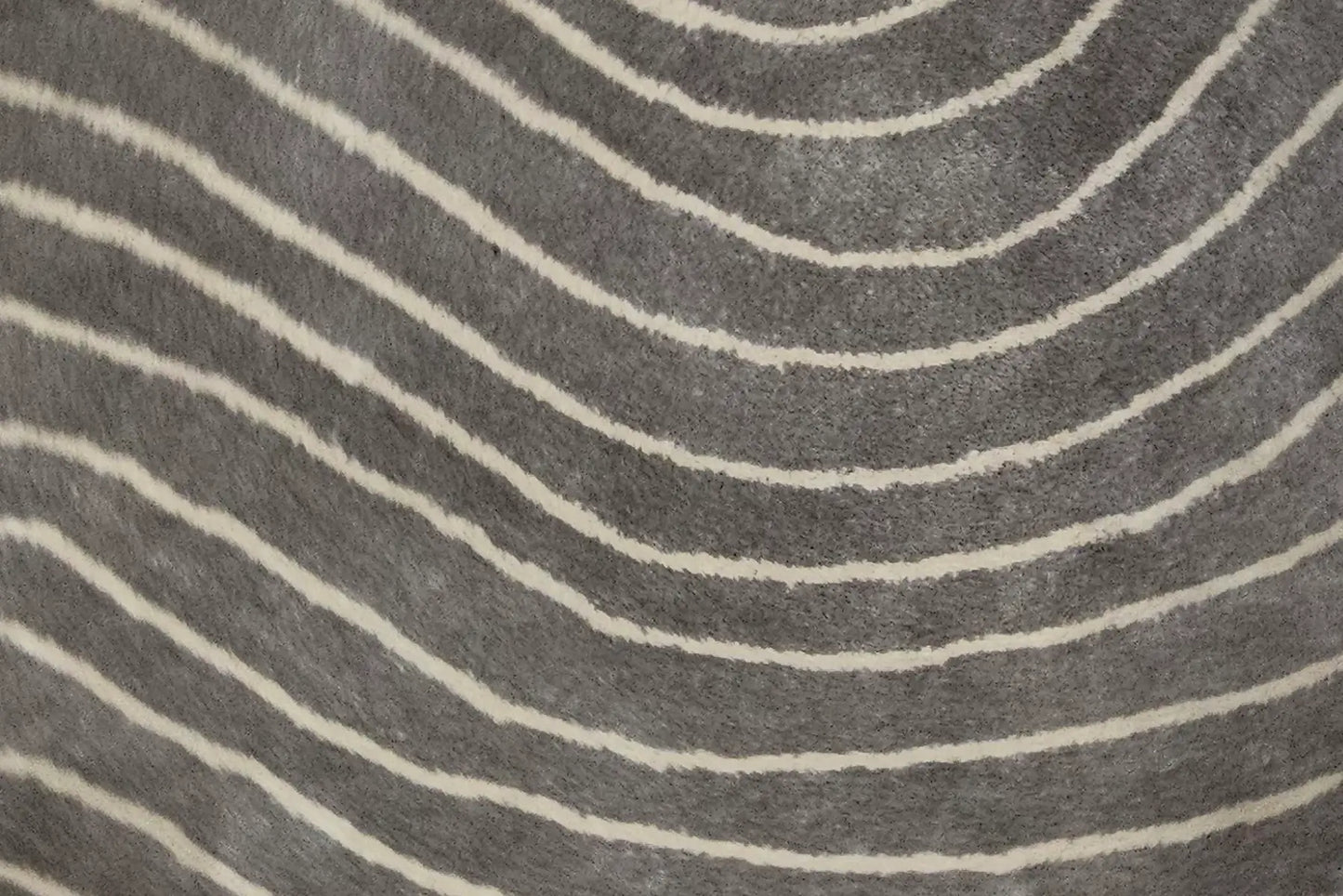 close up of a grey round rug