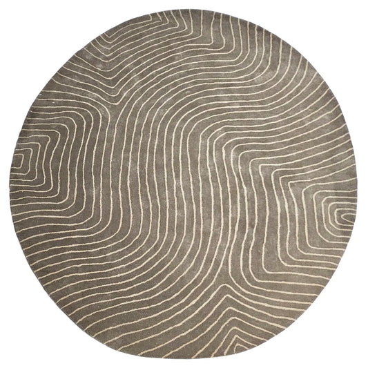 hand tufted round rug with wavy line pattern