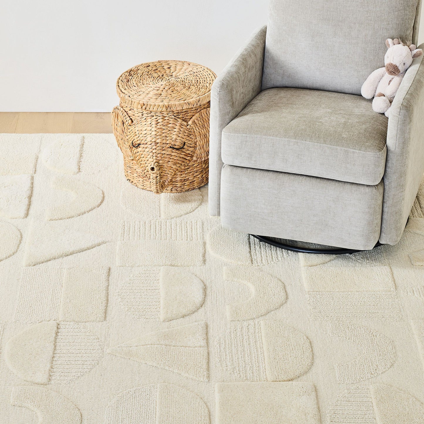 sofa chair on off-white hand-tufted rug