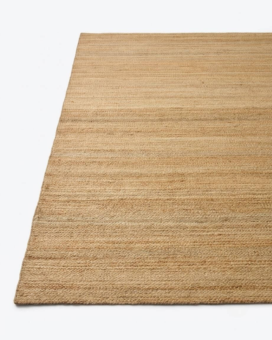 A rectangular natural textured jute rug