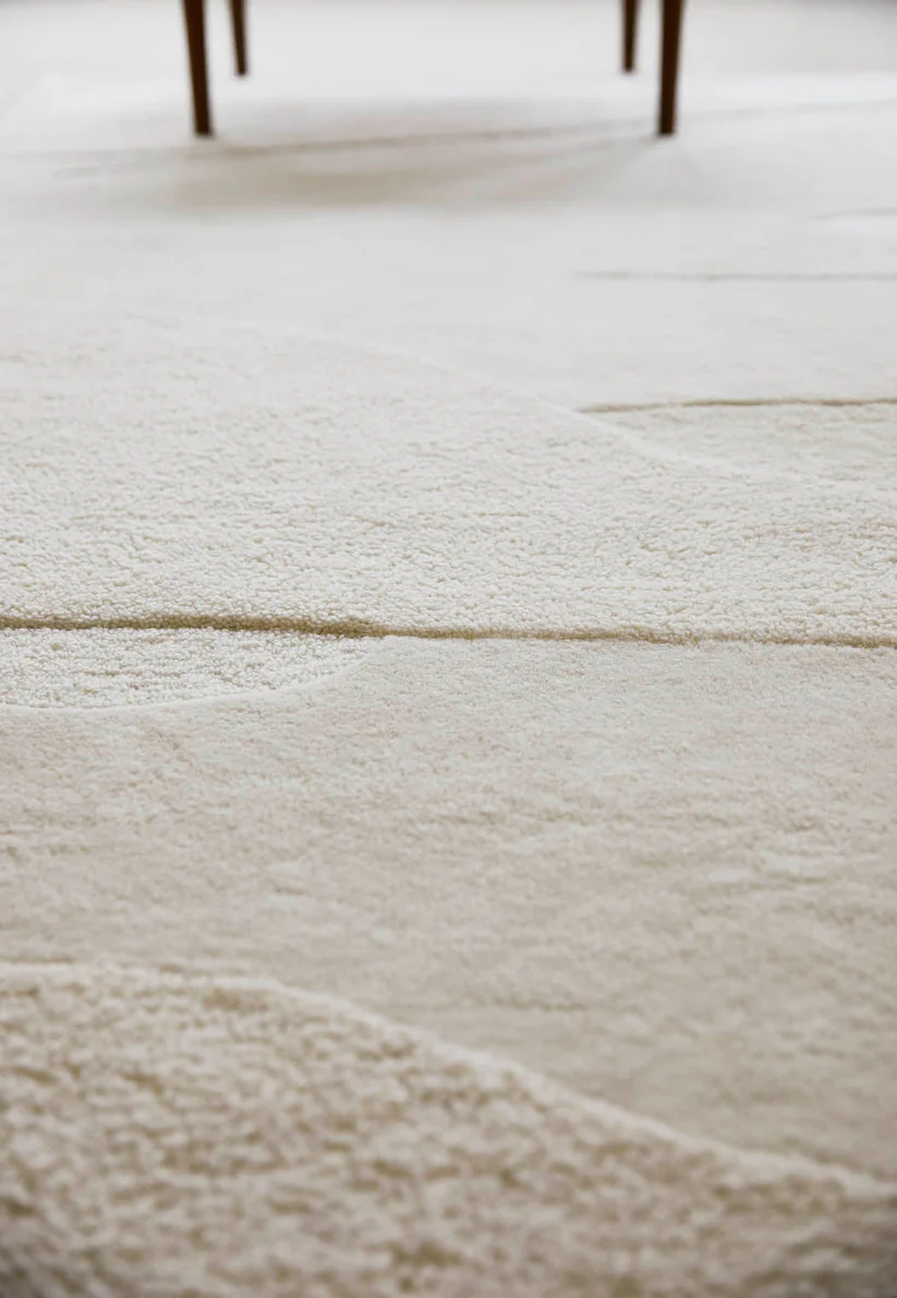close view of white-textured New Zealand wool rug