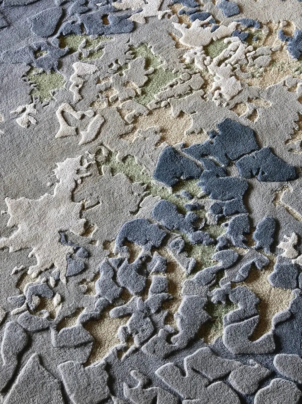 close view of premium hand tufted textured wool and silk rug in gray, blue, and beige colors
