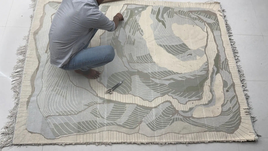 handmade wool rug finishing work by artisan