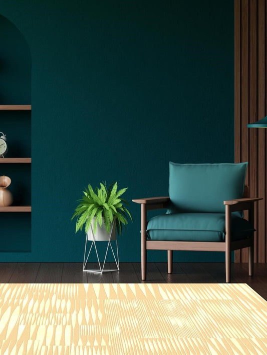 Modern living room with a teal armchair and a plant against a dark blue wall.