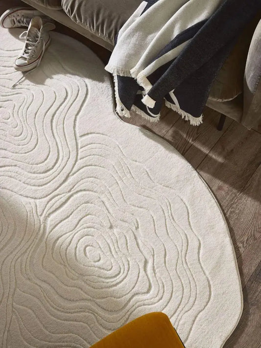 Ivory white shaped wool rug