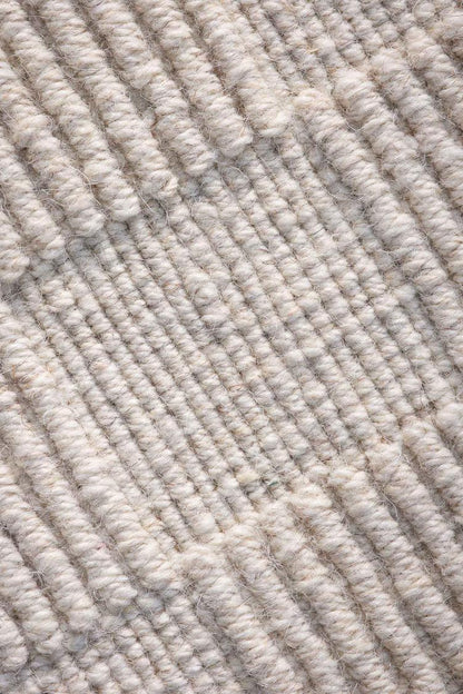close view of Sea off white handloom rug showing knot details