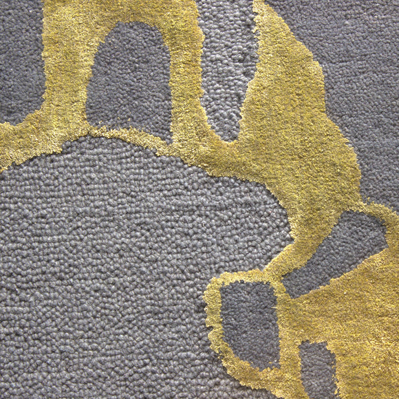close view of a abstract hand tufted wool and silk rug