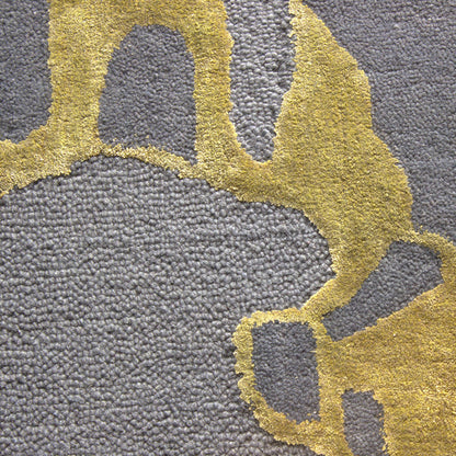 close view of a abstract hand tufted wool and silk rug