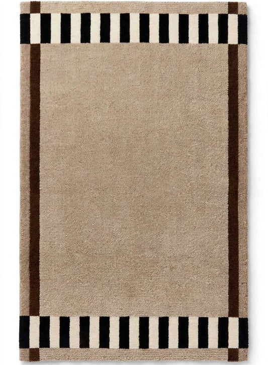 aibele hand tufted area rug with a solid beige center, black and cream side stripes