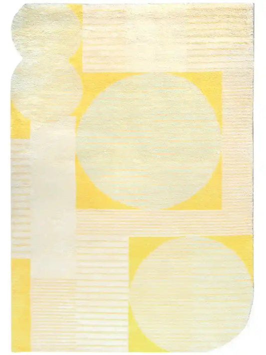 a hand knotted wool rug in yellow