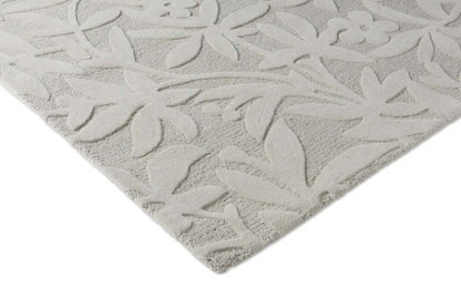 grey tufted wool rug corner