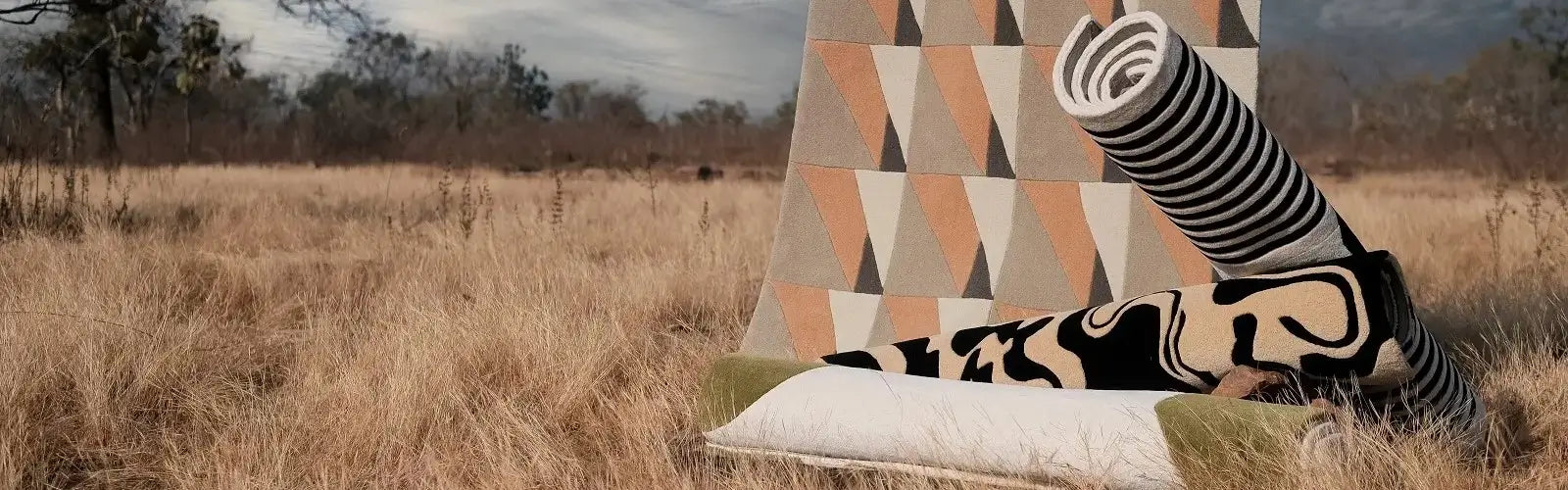 modern handmade rugs made by bhadohirug in a field