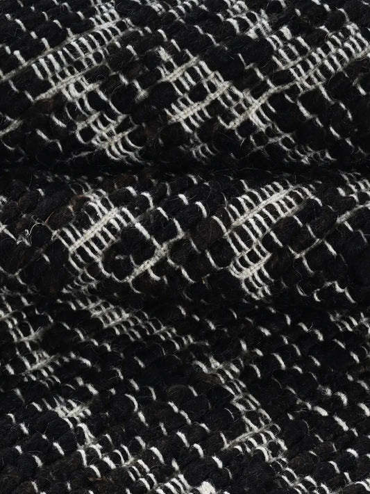 close up of hand woven black rug